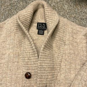 Jos A bank tan colored cardigan size large 60% lambs will 20% nylon.